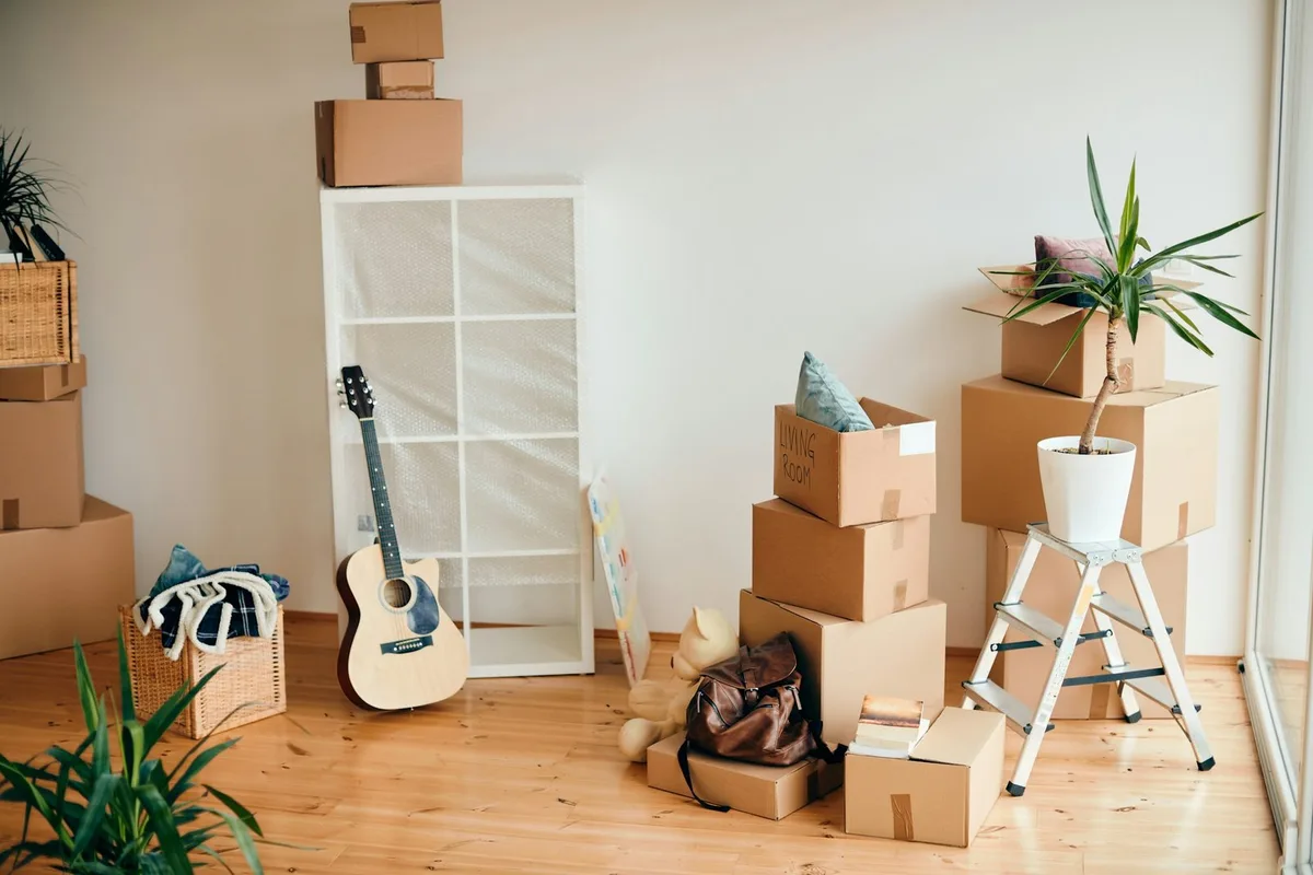 Packing boxes and belongings in a room on moving day