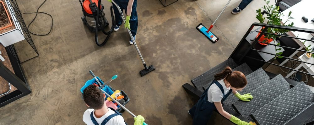 top view of cleaning company team cleaning modern office